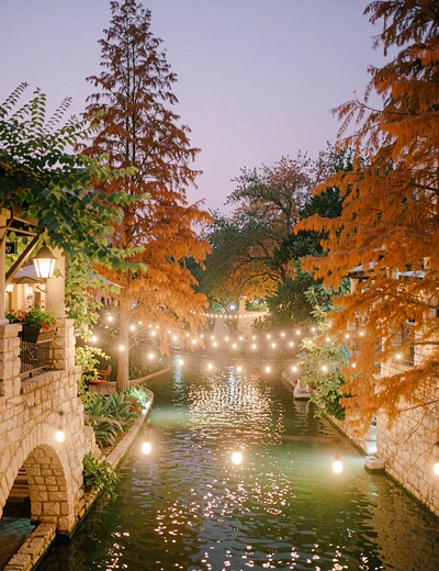 San Antonio River Walk at dusk with warm string lights reflected in the water